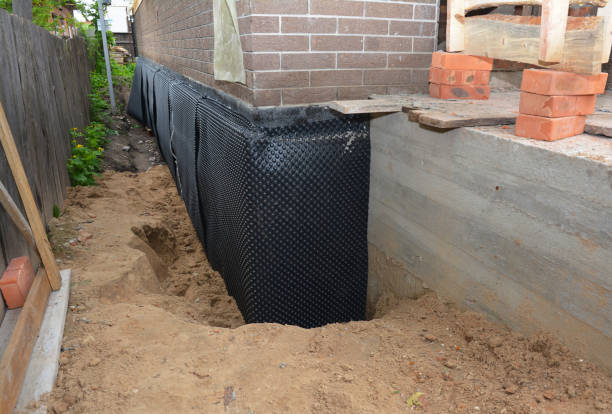 Happy homeowners after waterproofing job in Sedalia